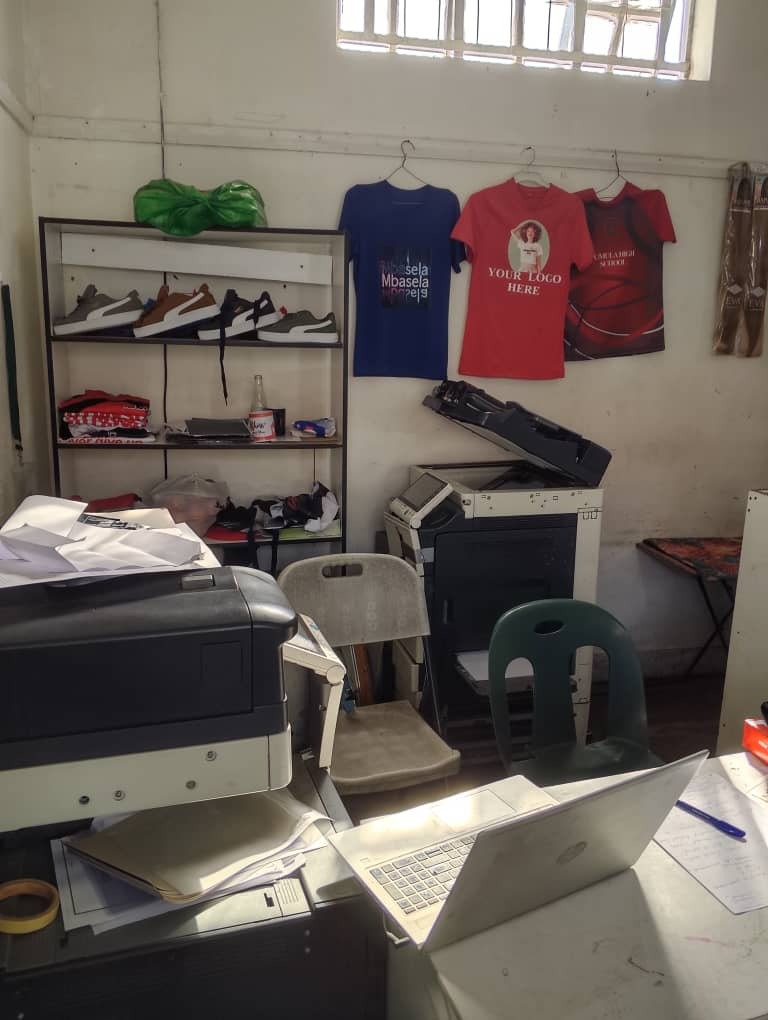 Heavy-duty printing and photocopy machinery inside the studio